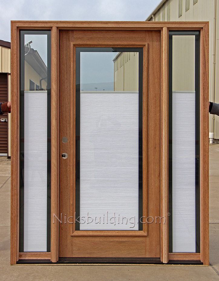 Mahogany door and sidelites with shades between the glass