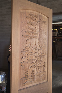 carved door mountain lion profile