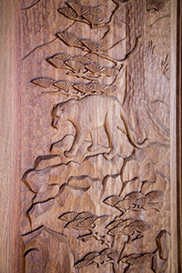 carved mountain lion door closeup