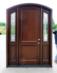 Arched Bellagio Door with iron classic sidelights