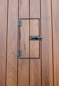 teak door with speakeasy door closed