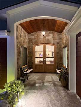 Installed Whitehawk arched exterior doors with clear glass